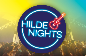 image of round neon logo with guitar that says 